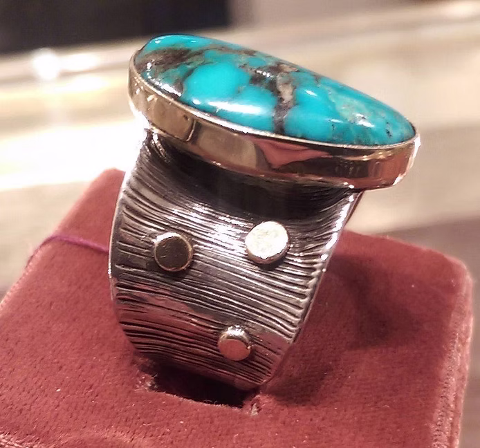 Turquoise stone ring on display