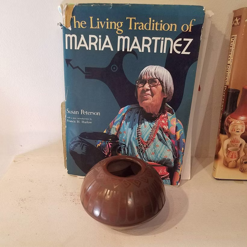 Ceramic pot in front of Maria Martinez book