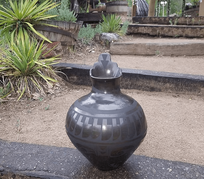 Artistic pottery vase in garden setting