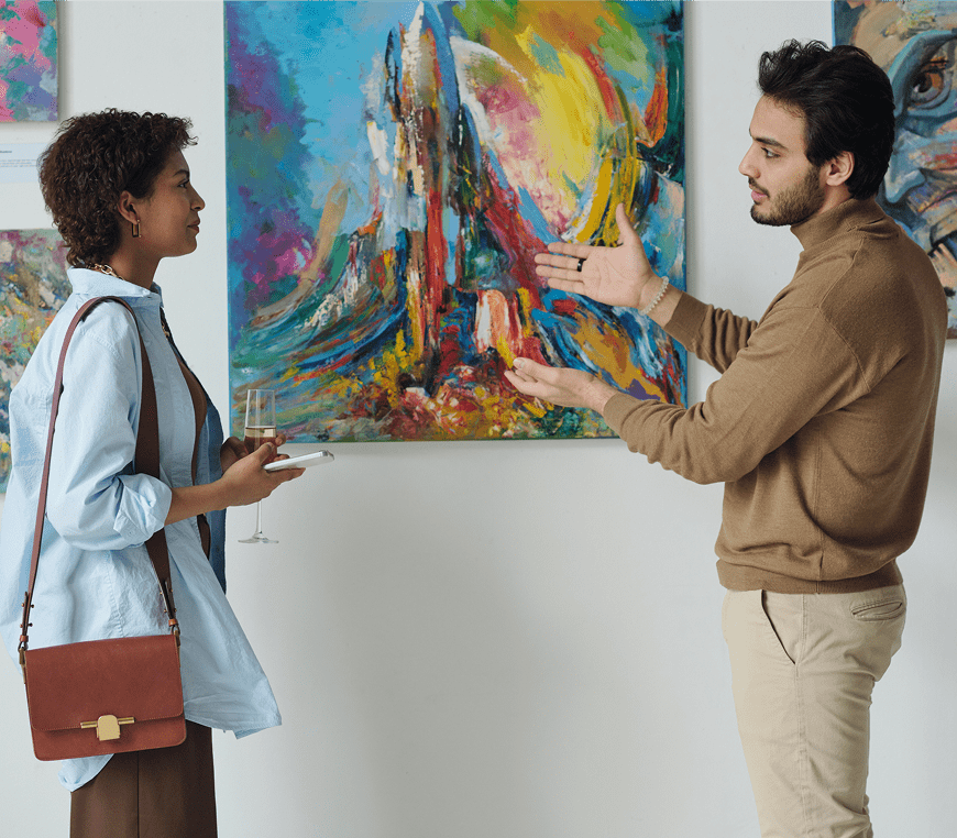 People admiring colorful abstract painting