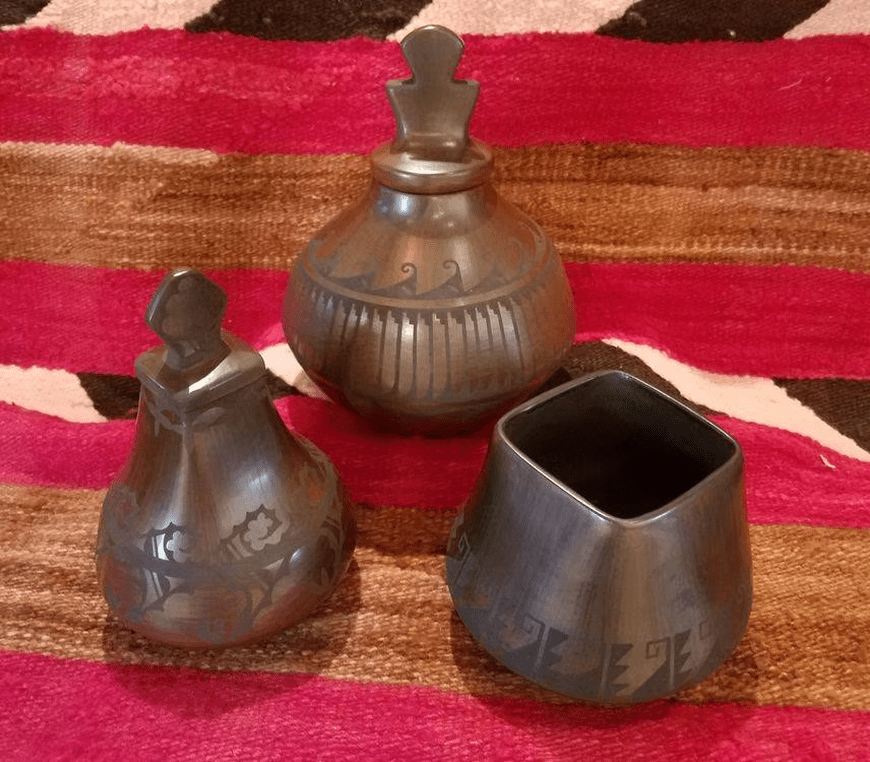 Artistic pottery set on striped textile